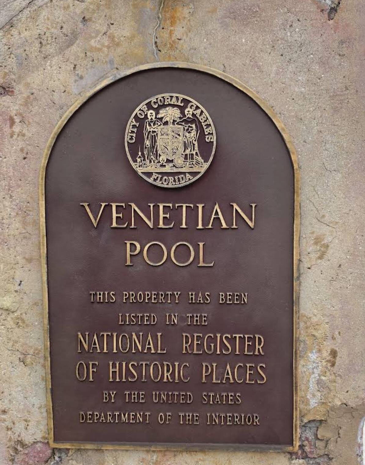 Historic Venetian Pool landmark plaque in Coral Gables Miami, a unique and romantic engagement photo location