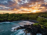 Golden sunset over the volcanic jungle landscape of the Big Island of Hawaii