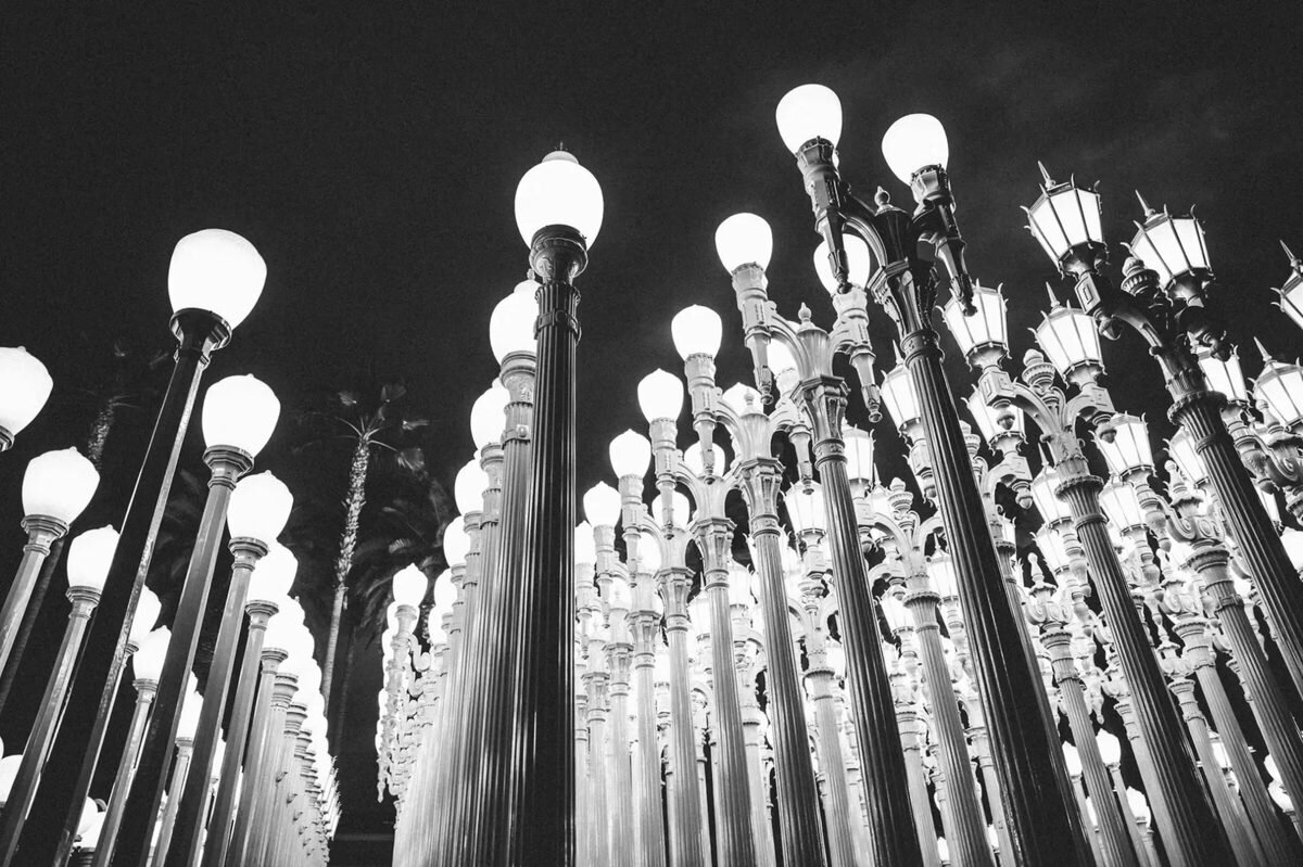 The Urban Light installation at LACMA in Los Angeles illuminated at night, a striking and iconic location for engagement photography