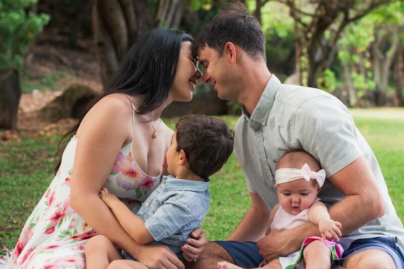 Couple with toddler & baby, tropical garden