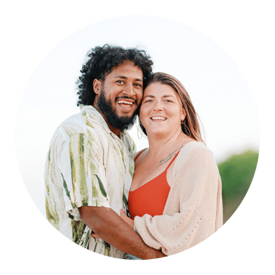 The Dreamgraphy Big Island photography team, a smiling couple posing together outdoors on the Big Island of Hawaii