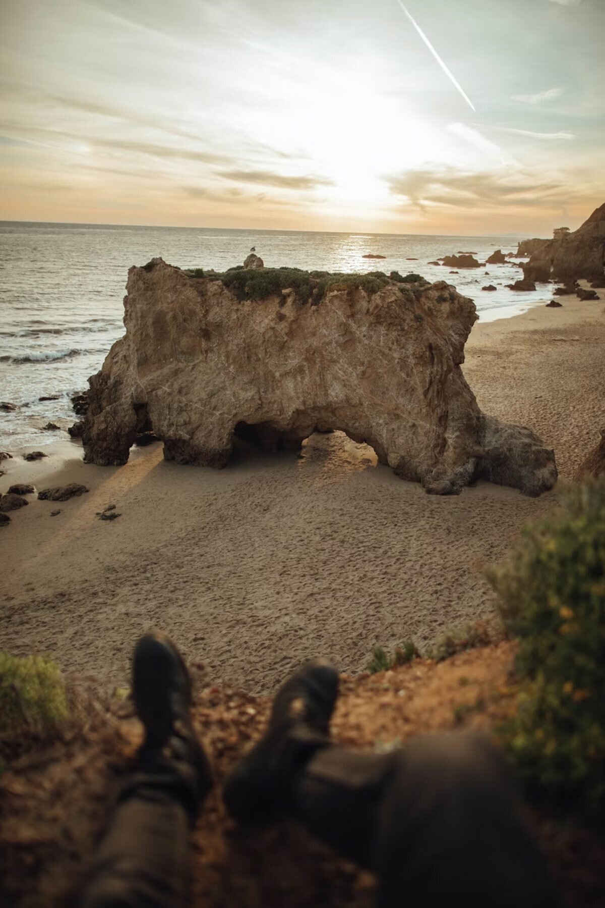 Sea stack rock arch at El Matador Beach in Malibu at sunset, a dramatic location for Los Angeles engagement photography