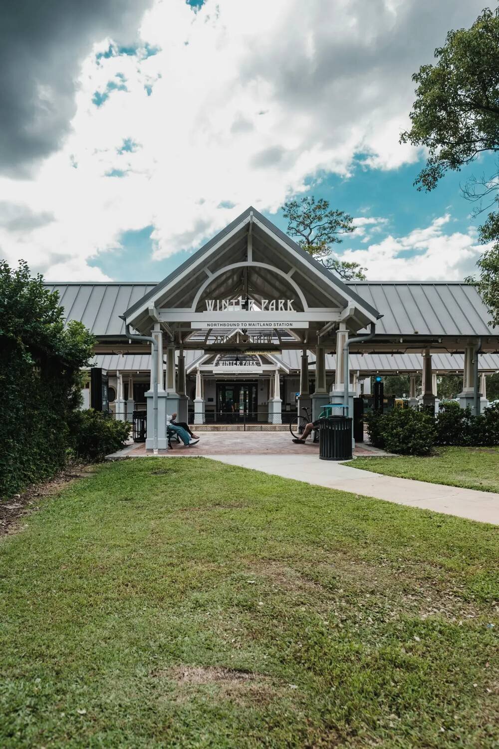Winter Park station pavilion surrounded by green lawns and trees, a charming engagement photo location near Orlando